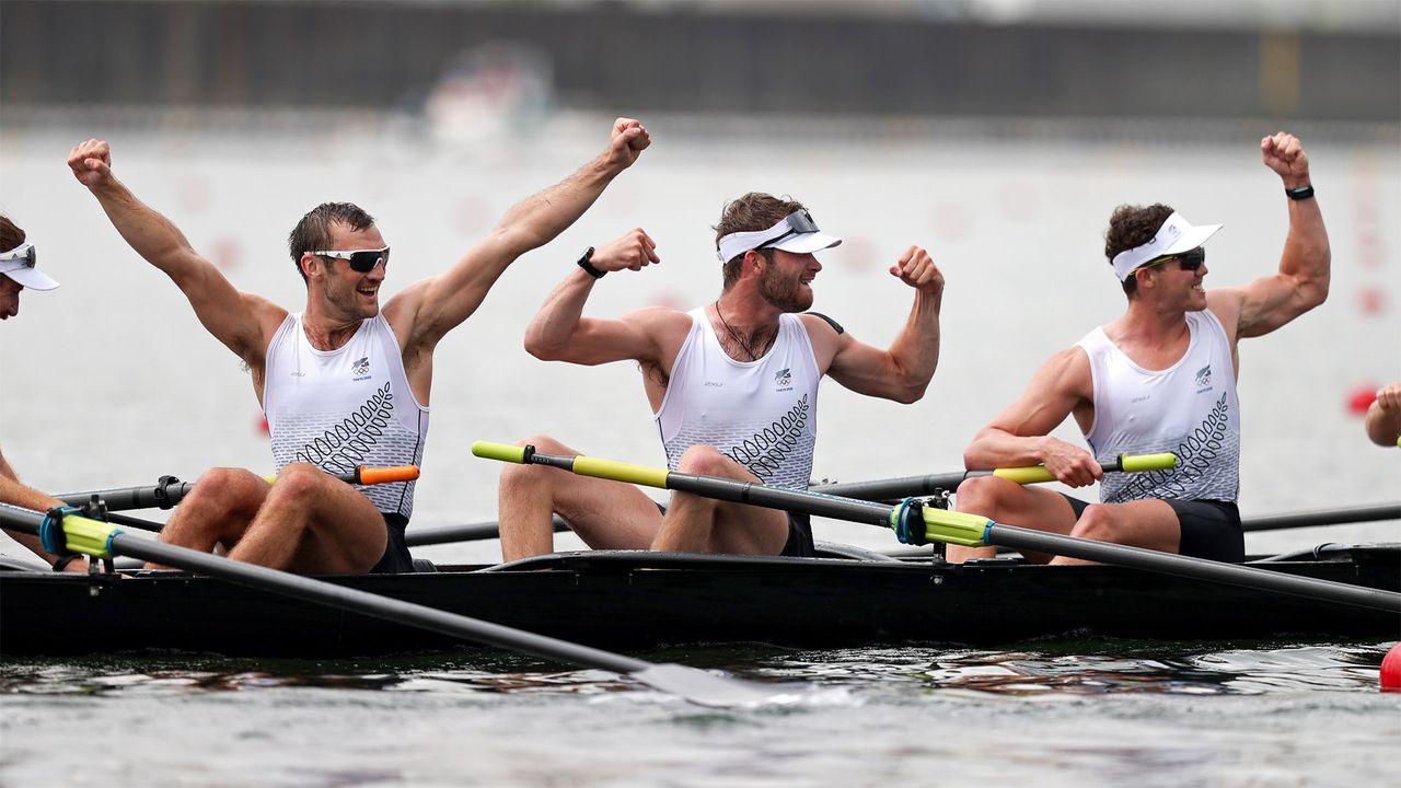 Members of the New Zealand team celebrate winning gold in the men&#039;s eight at Tokyo 2020.