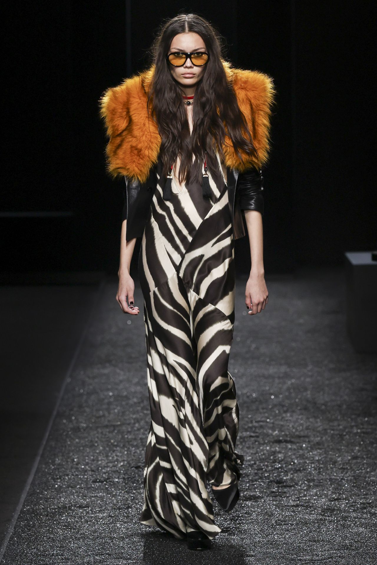 Nina Ricci model wears zebra dress and orange fur stole
