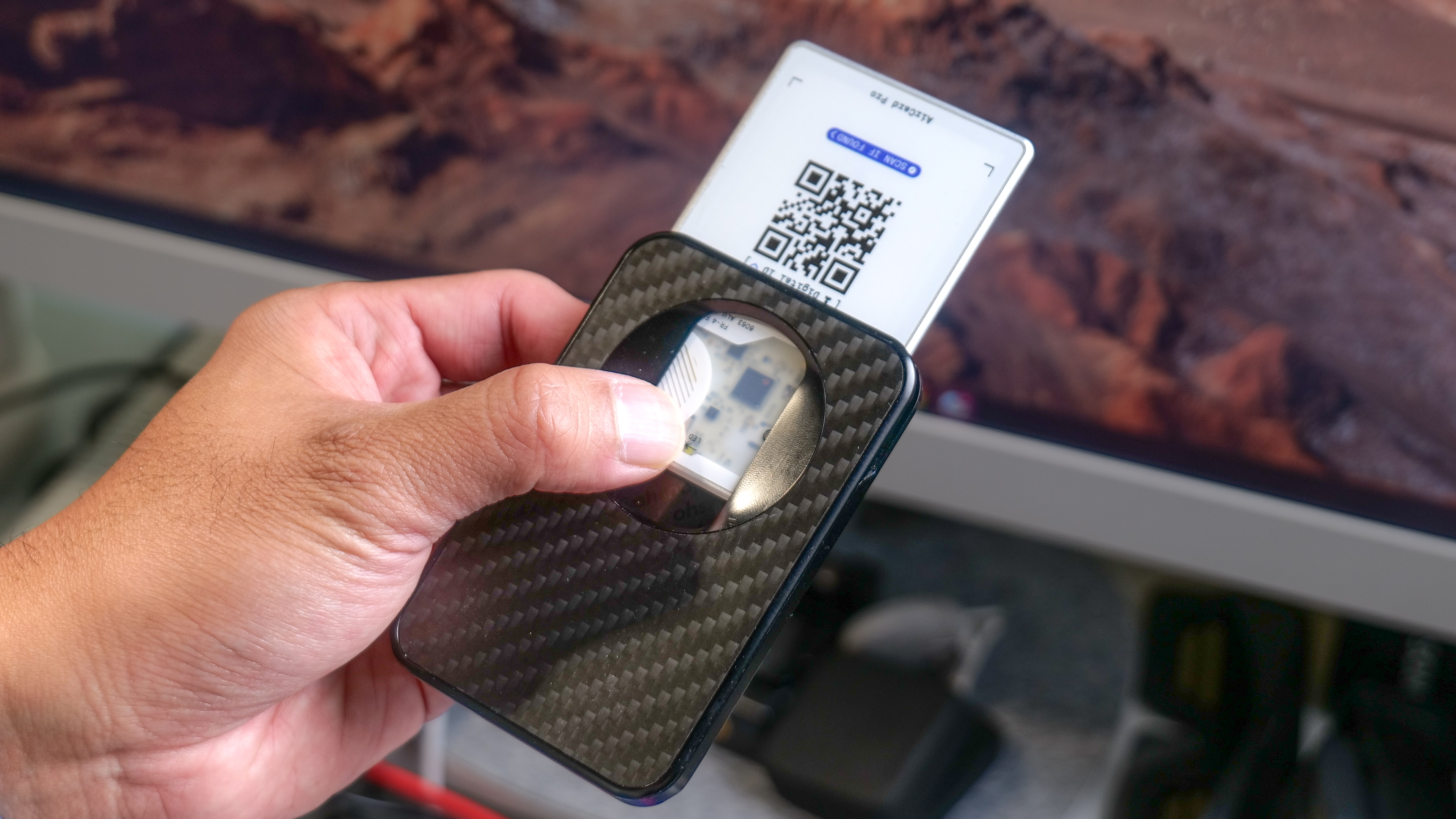 Rolling Square AirCard Pro in a wallet with QR code showing.