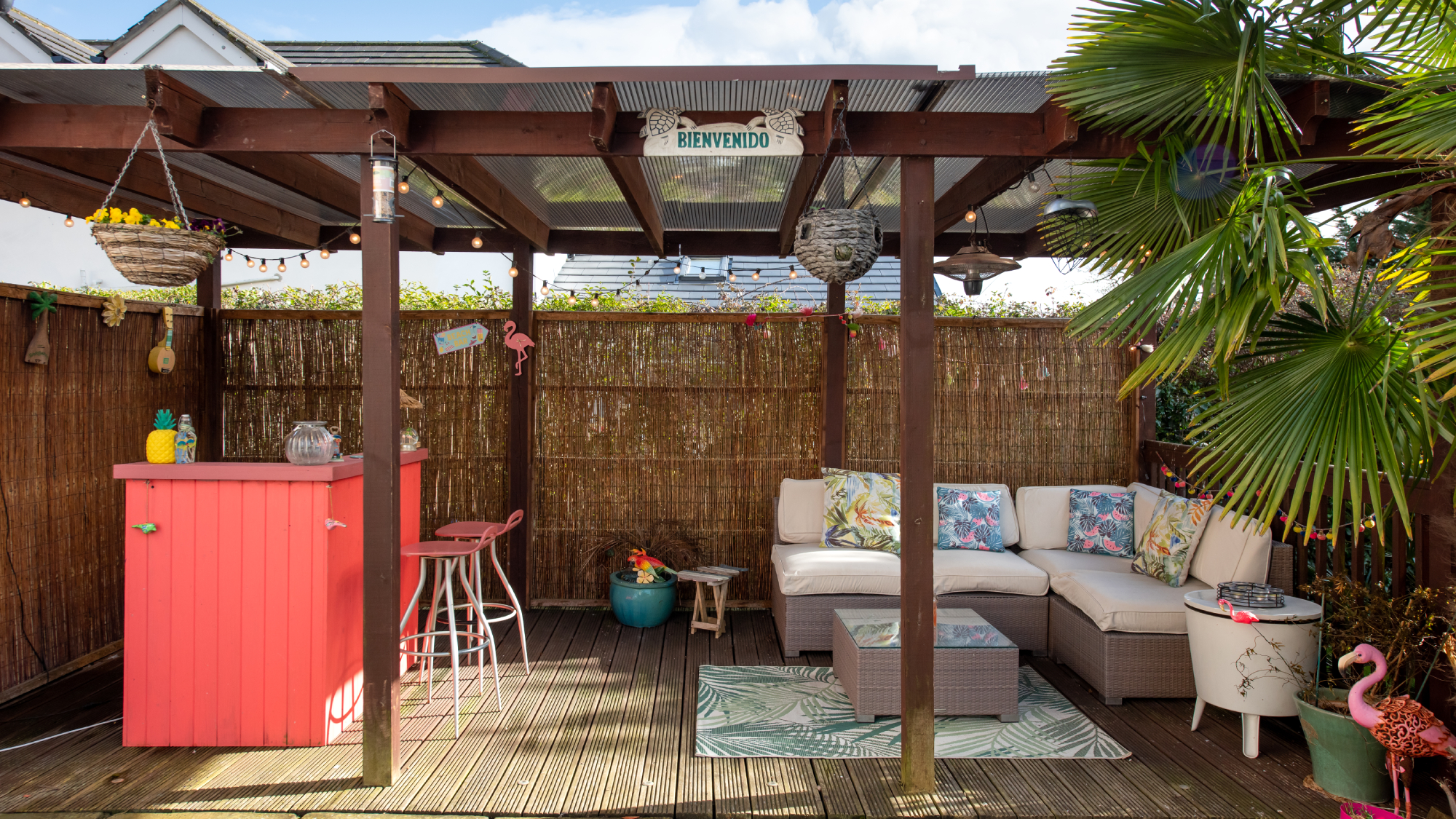 pergola with bamboo fence roll used at back to screen it from garden behind