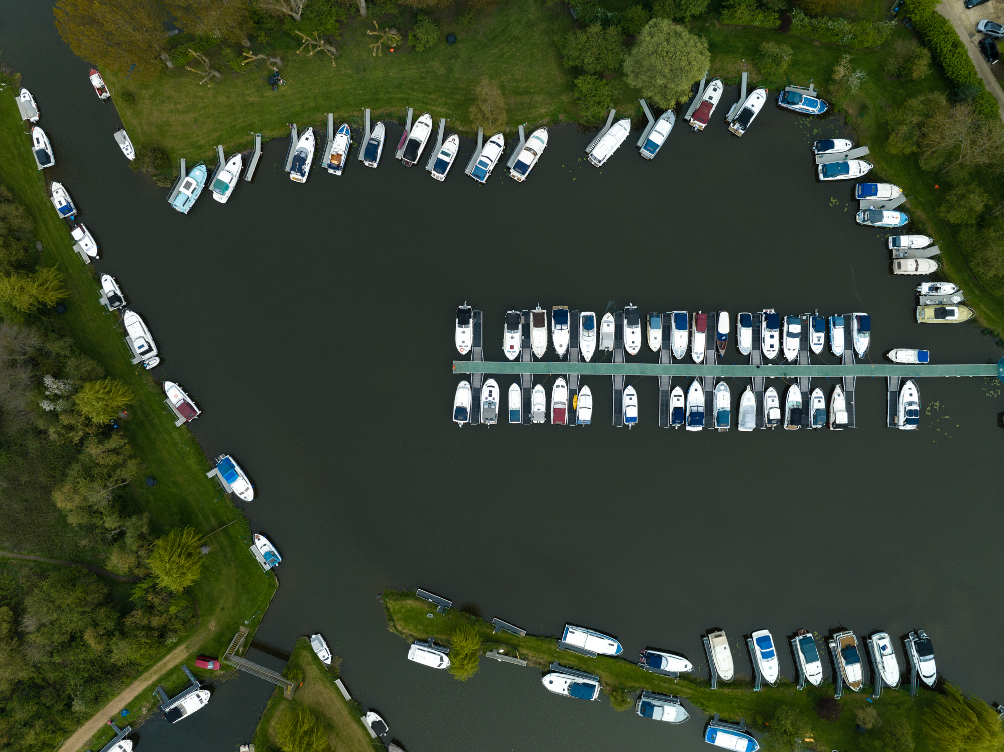 Aerial photo of boats moored to a jetty shot with DJI Mavic 3 Pro main 24mm camera