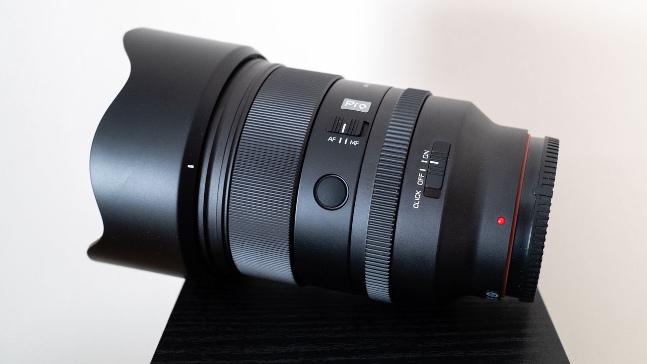 Viltrox AF 50mm f/1.4 Pro FE side view of controls with the lens hood attached