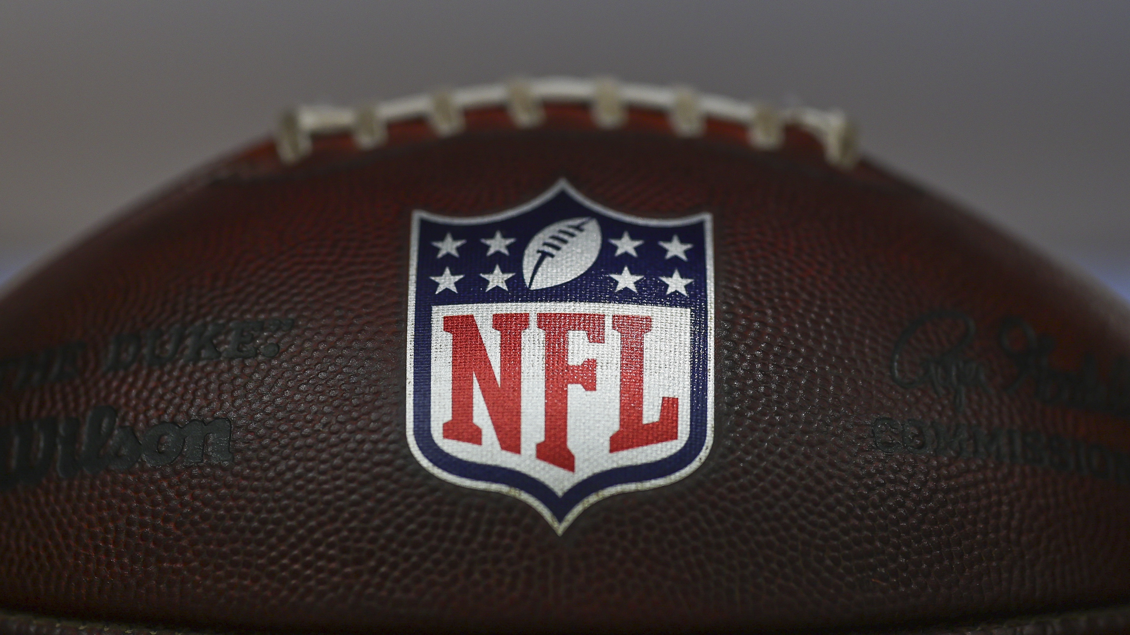 A detail view of the NFL Shield logo on a ball during rookie minicamp at CrossCountry Mortgage Campus on May 10, 2025 in Berea, Ohio.