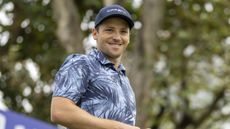 Stefano Mazzoli smiles while on the golf course during an Asian Tour event