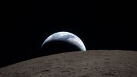 The Earth sets over the lunar surface in this photograph taken by Artemis II astronauts