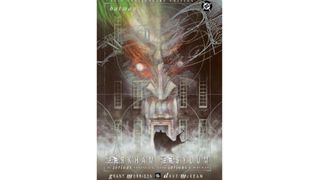 The cover of Arkham Asylum: A Serious House on Serious Earth with Batman standing outside Arkham with the Joker's face in the background.