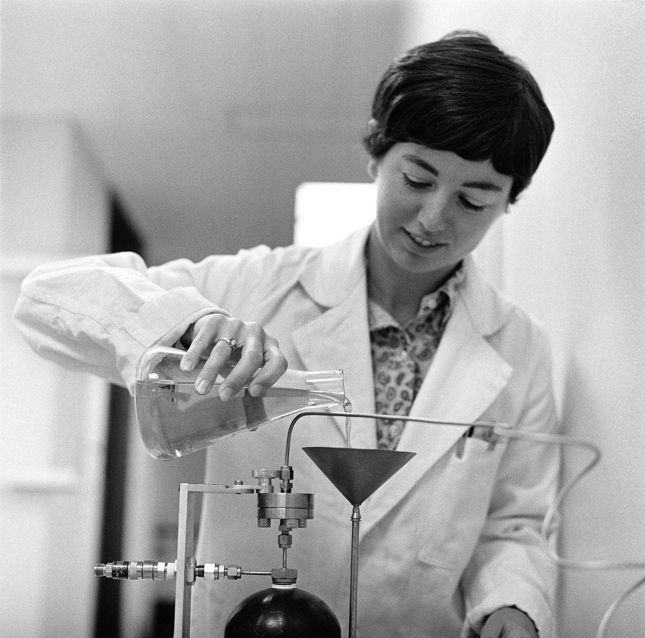 Biologist Caye Johnson prepares a vitamin mixture for petri dishes of the lunar biological sampling experiments at NASA&rsquo;s Ames Research Center in 1969. Scientists there tested Apollo 11 moon rock samples for signs of life.