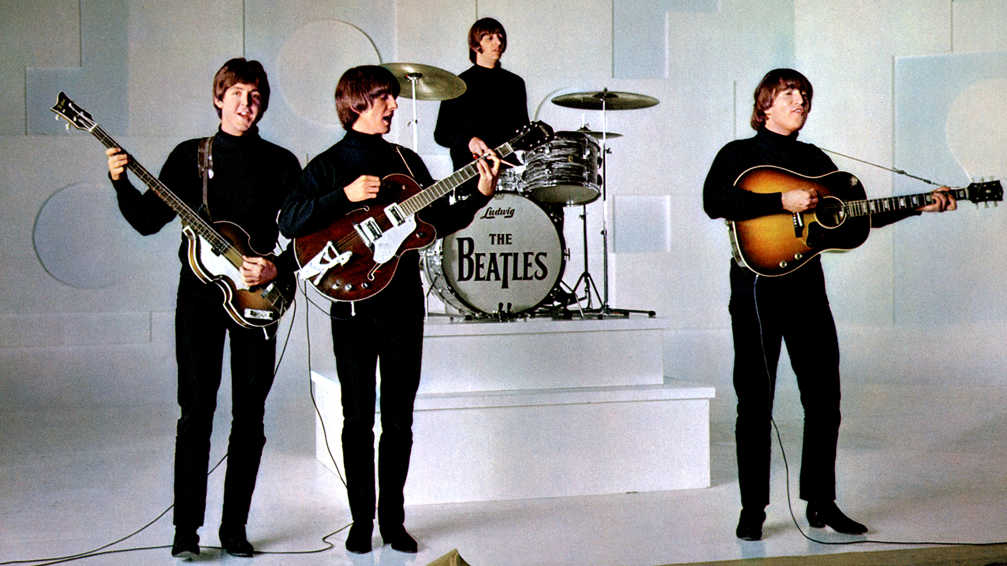 The Beatles mime to the song "Help!" in the 1965 movie Help!. (from left) Paul McCartney, George Harrison, Ringo Starr and John Lennon