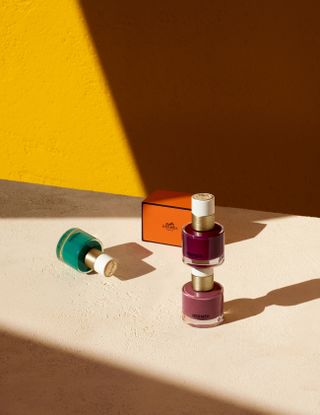 Hermes nail polish in shades of purple, lilac and blue