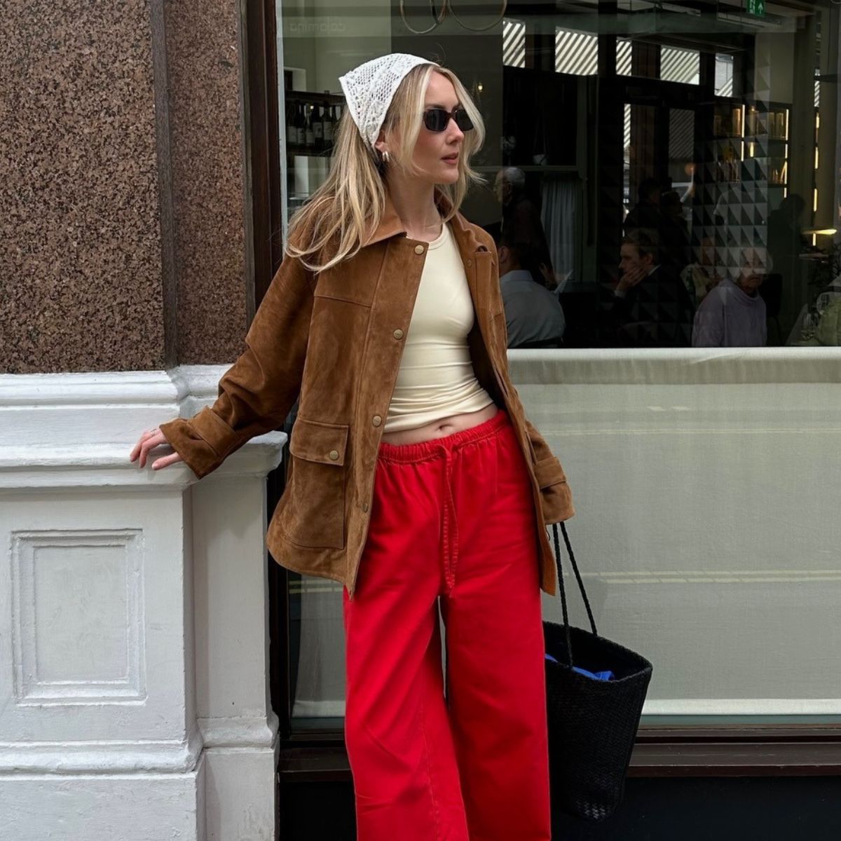 Chloe wearing jacket and linen trousers