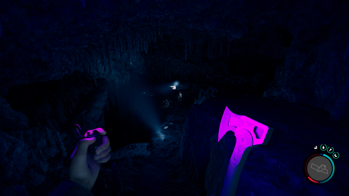 Sons of the Forest - a dark cave with a view down at a body of water and a pool floatie inside.