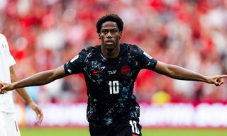 Jonathan David #10 of Canada celebrates with teammates after scoring during the FIFA World Cup 2026 Group B match against Qatar at BC Place Vancouver on June 18, 2026. 