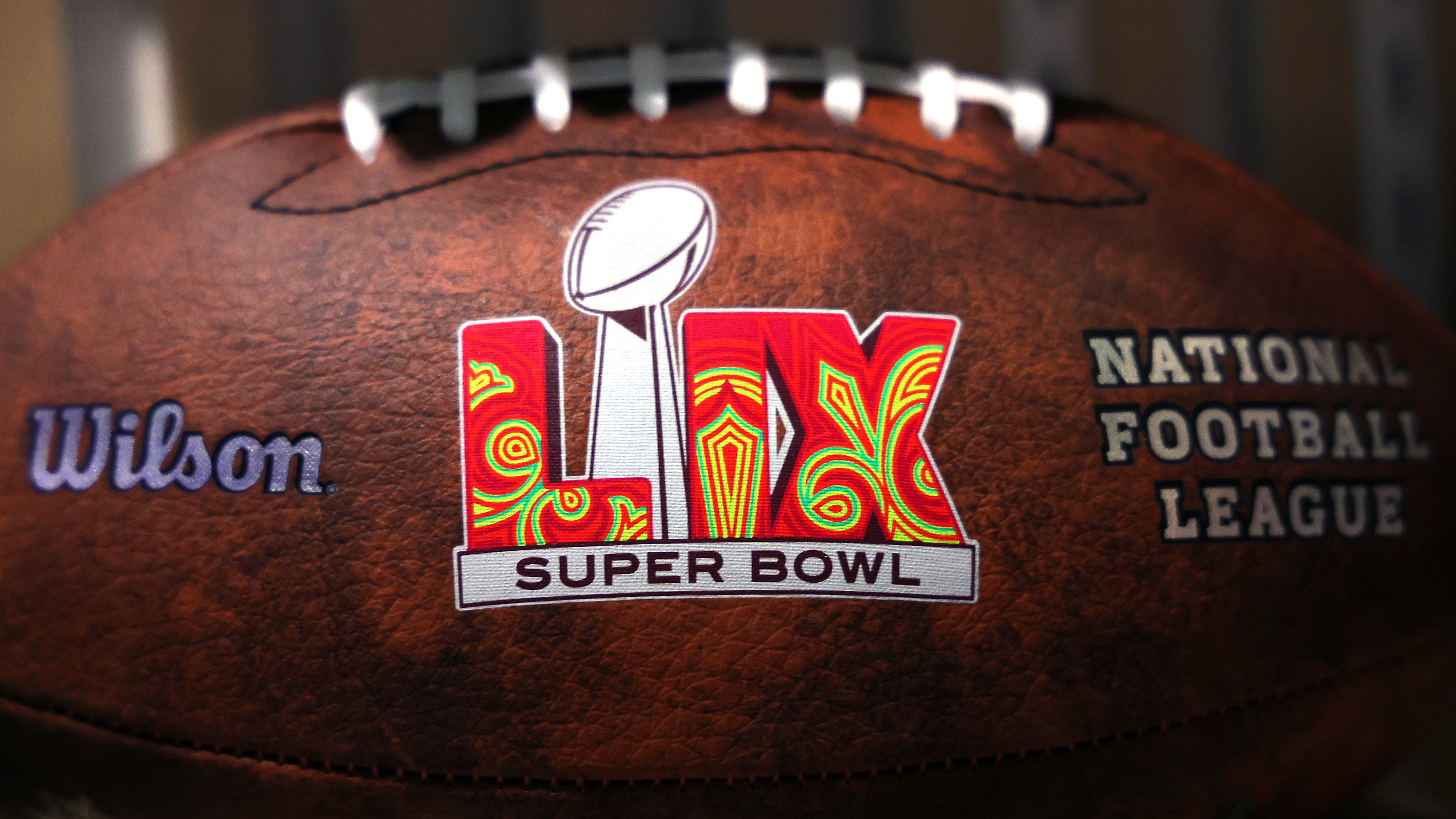 NEW ORLEANS, LOUISIANA - FEBRUARY 07: A detail of footballs at the NFL Experience fan festival ahead of Super Bowl LIX on February 9, 2025 in New Orleans, Louisiana.