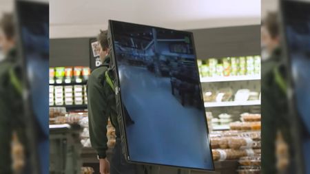 Chris the Producer with a TV strapped on his back to avoid camera surveillance.