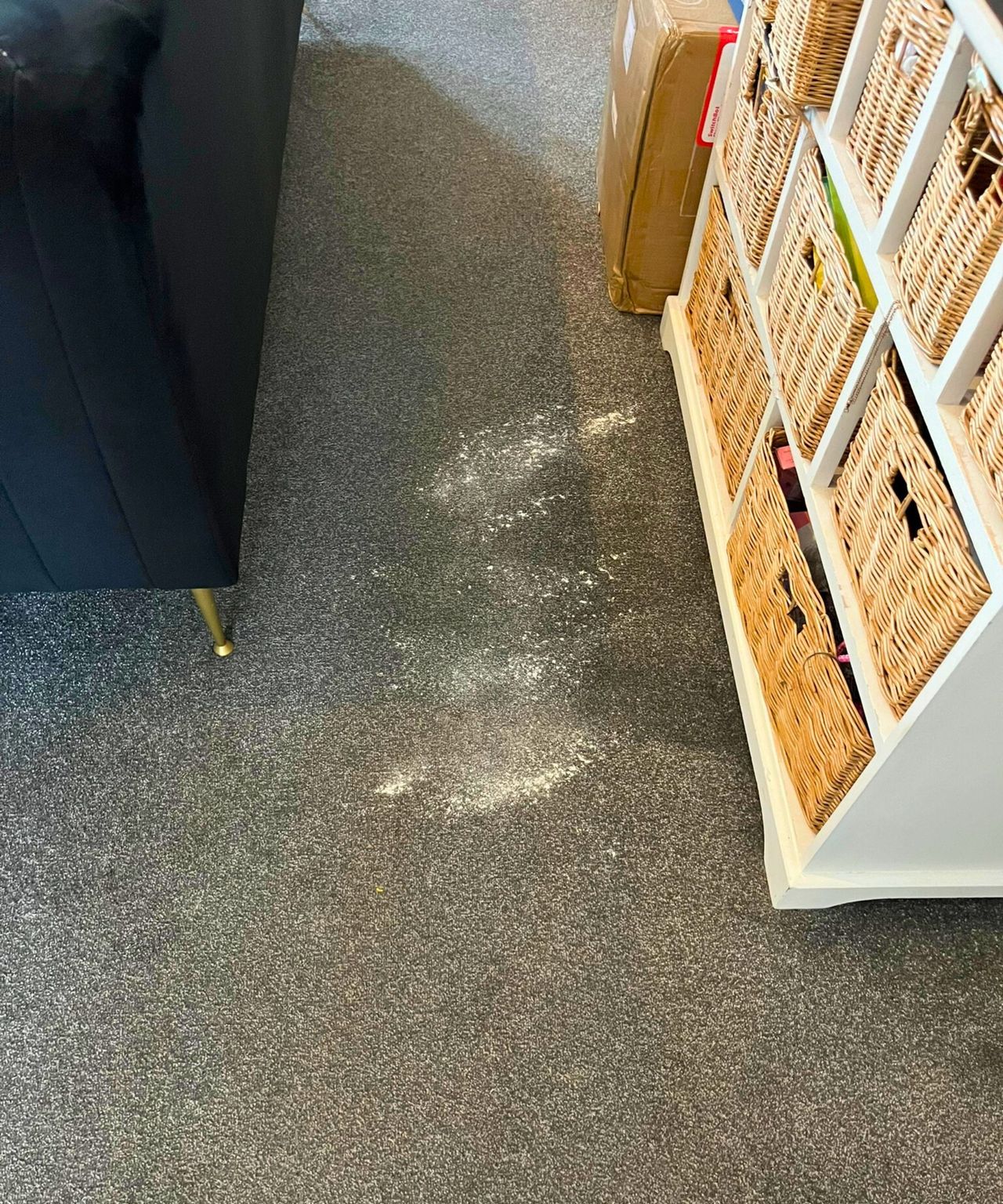 Flour on a gray carpeted floor