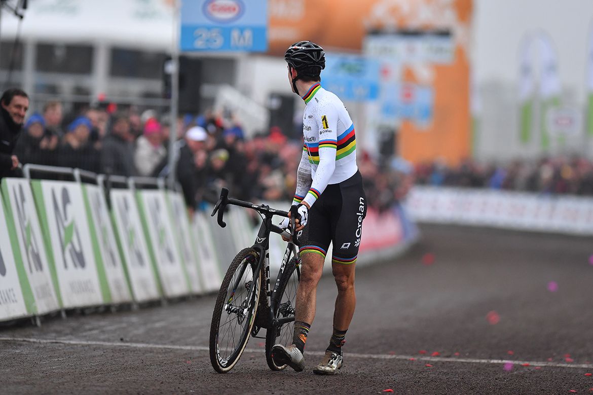 Woet Van Aert crosses the line on foot