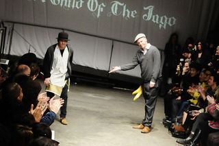 Corre and his creative partner Simon 'Barnzley' Armitage take a bow at the close of the show