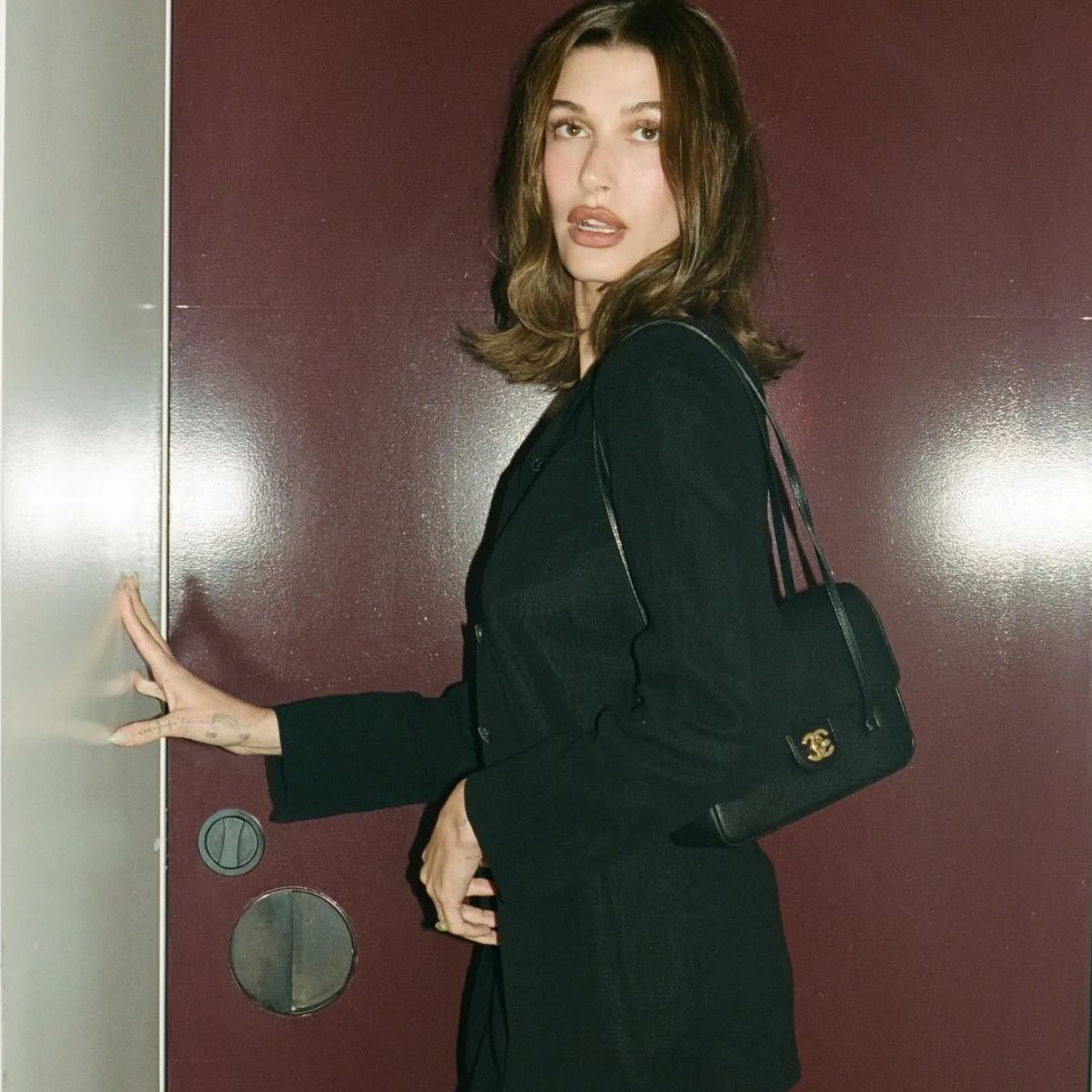 image of Hailey Bieber with Chanel small flap bag