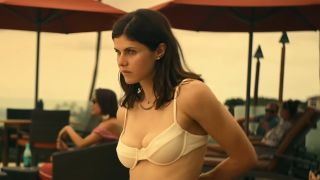 Alexandra Daddario, in a white top, about to take a swim in HBO's first season of 'The White Lotus.'