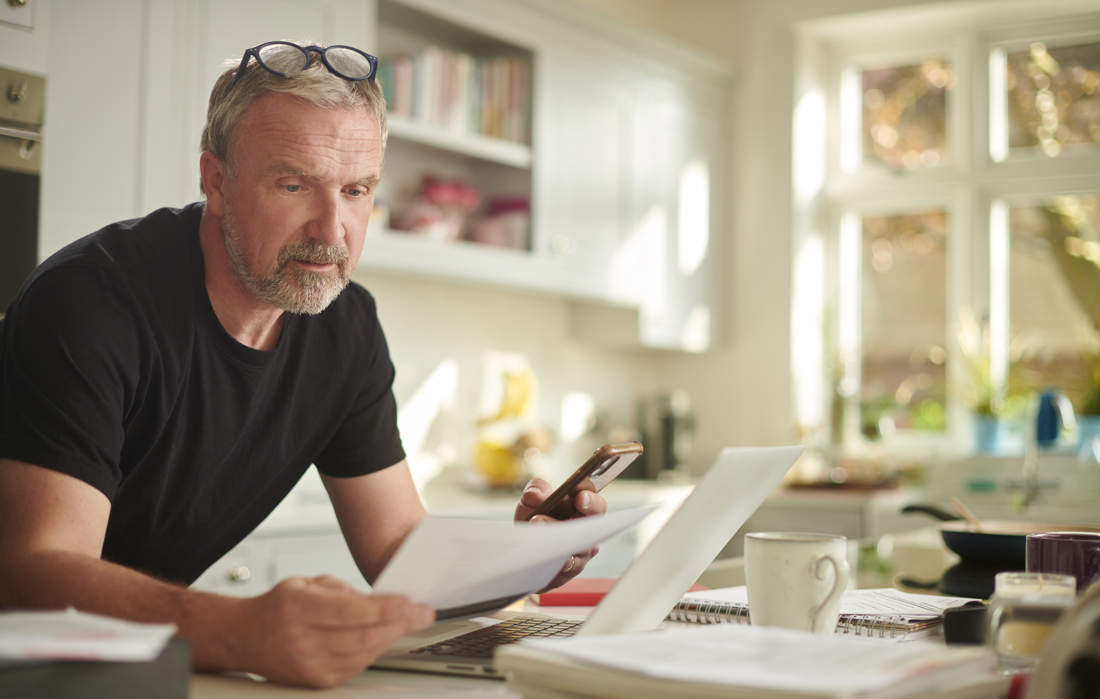 Older man looking over taxes