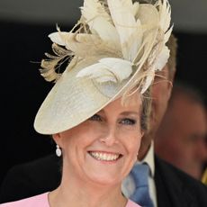 Duchess Sophie wears a bright pink dress and matching hat and Kate Middleton wear a blue jacket with matching hat