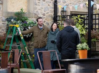 Liam, Chas and Aaron sort out a window which has been broken