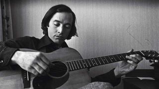 Ry Cooder plays his guitar during an interview, Amsterdam, Netherlands in 1973