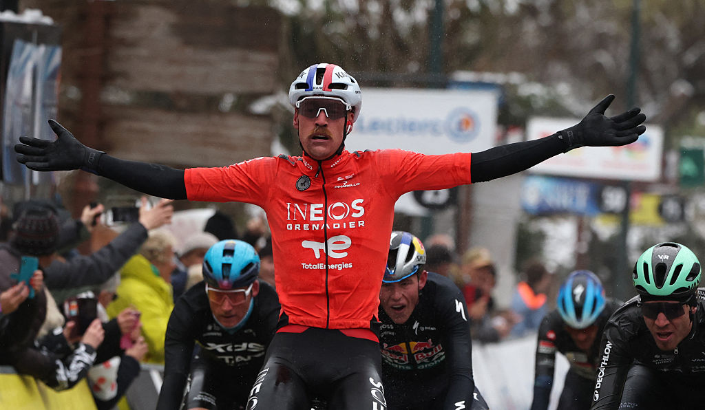 INEOS Grenadiers' French rider Dorian Godon celebrates as he crosses the finish line to win the 7th stage of the Paris-Nice cycling race, 47 km between Le Broc and Isola-Village, on March 14, 2026. Due to deteriorating weather conditions, the route of stage 7 has been changed to a 47 km race from Le Broc to Isola. (Photo by Anne-Christine POUJOULAT / AFP)