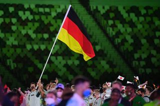 Germanys flag bearer Patrick Hausding L leads the delegation as they parade during the opening ceremony of the Tokyo 2020 Olympic Games at the Olympic Stadium in Tokyo on July 23 2021 Photo by Andrej ISAKOVIC AFP Photo by ANDREJ ISAKOVICAFP via Getty Images