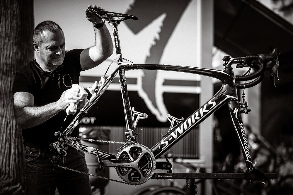 A mechanic cleans one of the bikes