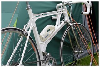 A Kirk Precision Magnesium framed road bike leaning against a tent at L'Eroica Brittania 2017
