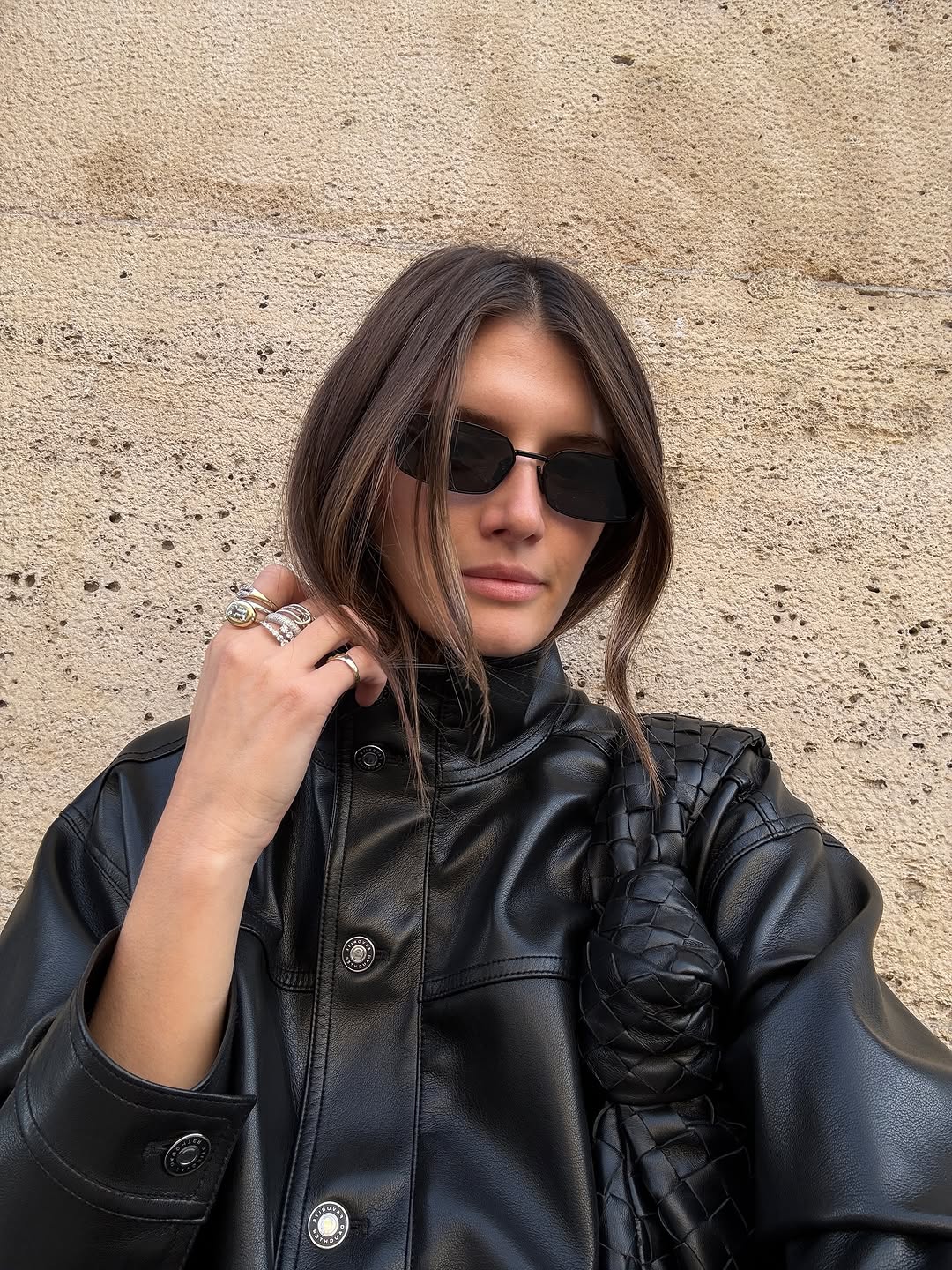 Woman wearing collared leather jacket trend fall 2025.