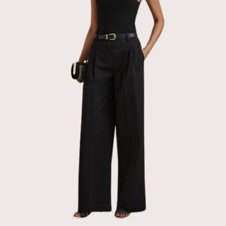 cropped image of woman in black wide leg trousers