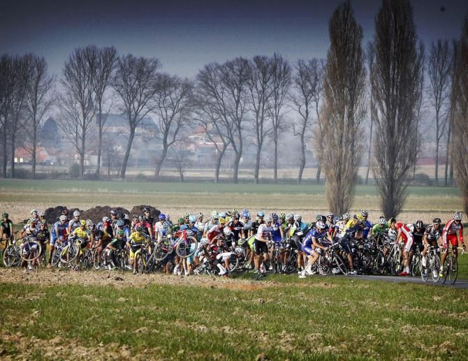 The peloton roll through at E3 Harelbeke
