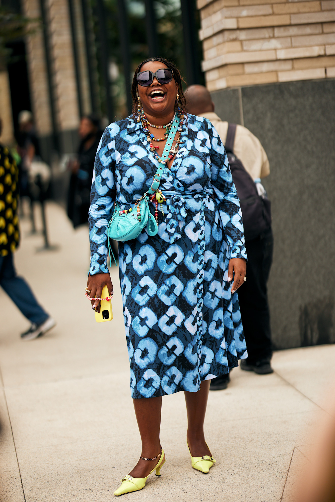 woman at fashion week wearing a chunky beaded necklace