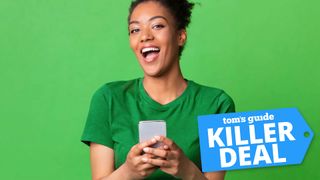 Woman smiling while holding a phone against a green background with 'Killer Deal' badge overlaid