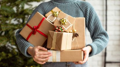 Woman holding pile of gifts