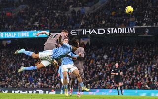 Tottenham's Dejan Kulusevski beats Nathan Ake in the air to equalise against Manchester City