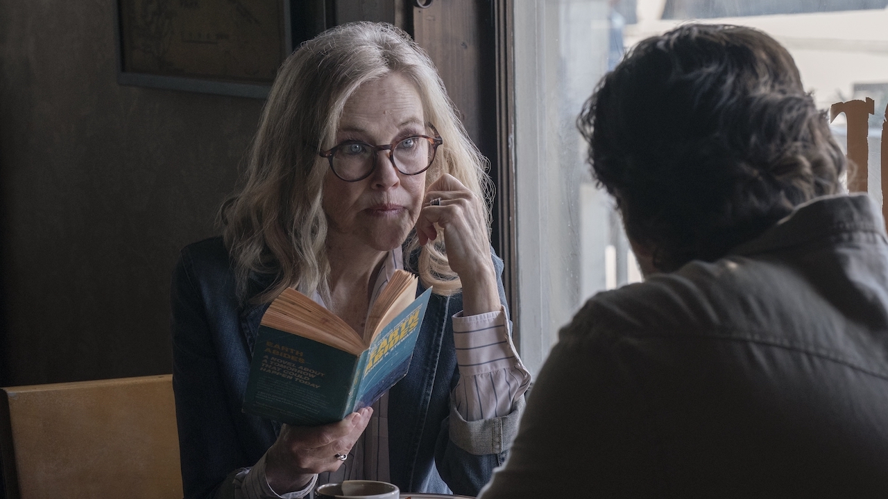Gail holding book and talking to Joel in Jackson restaurant in The Last of Us Season 2 Ep 6