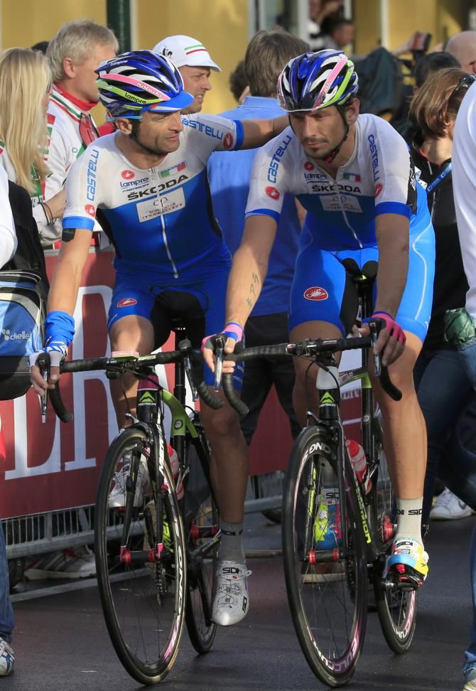 Scarponi and Pozzato cross the line together