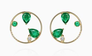 two neat golden hoops loop around emeralds earrings by GFG Jewellery