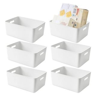 Six white plastic storage bins with cut out handles