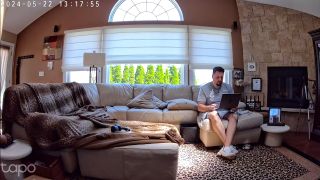 Man works on couch during day