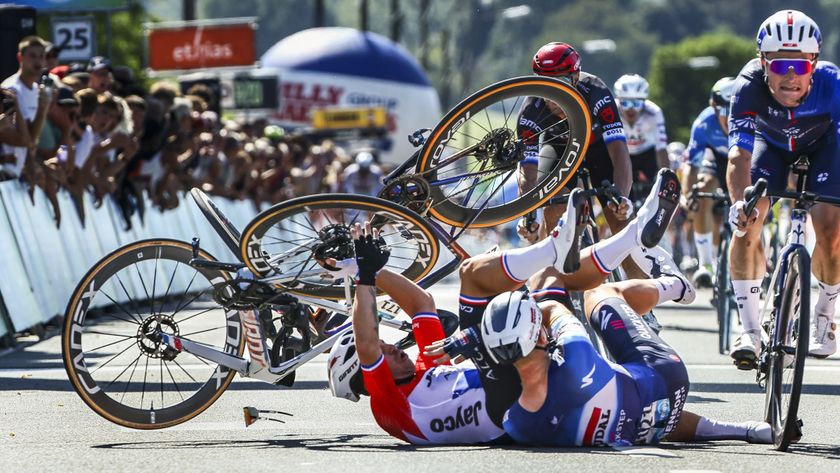 Team Jayco Alula's Dutch rider Dylan Groenewegen (L) and Soudal Quick-Step's Belgian rider Tim Merlier (2ndL) crash at the end of the first stage of the Renewi Tour
