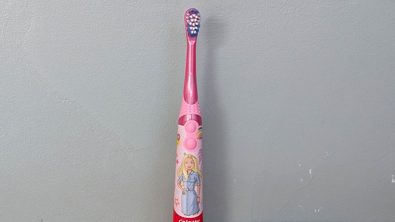 Colgate Kids Battery Powered electric toothbrush being tested by our reviewer
