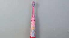 Colgate Kids Battery Powered electric toothbrush being tested by our reviewer