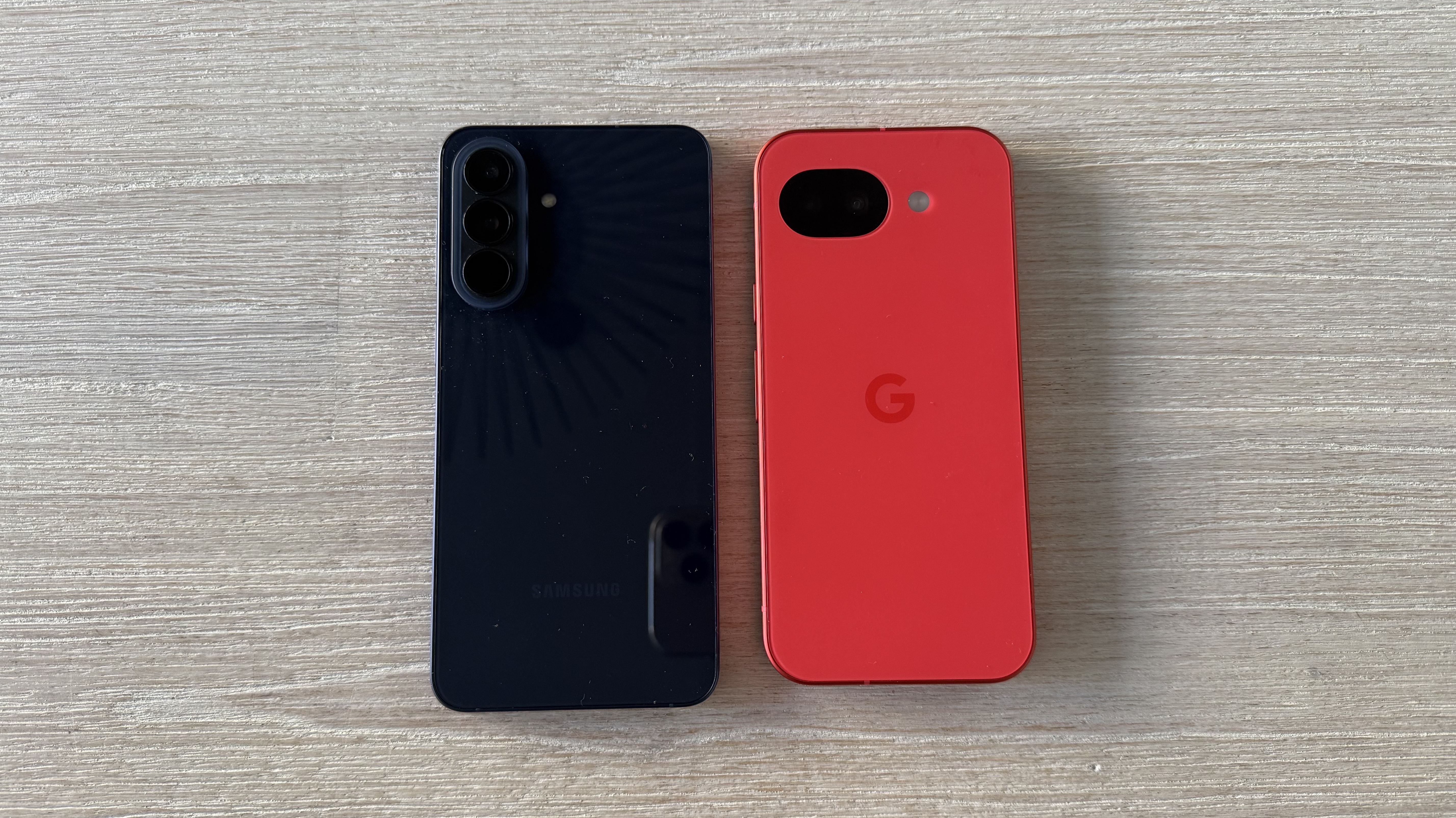 Samsung Galaxy A57 and Google Pixel 10a side by side on a table