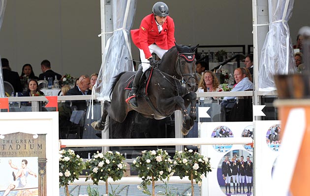 Hans-Dieter Dreher (DE) riding Embassy II DSQ th in the Grand Prix Presented by Qatar at the Longines Global Champions Tour of London taking place on Horse Guards Parade in central London between the 14-16th August 2014