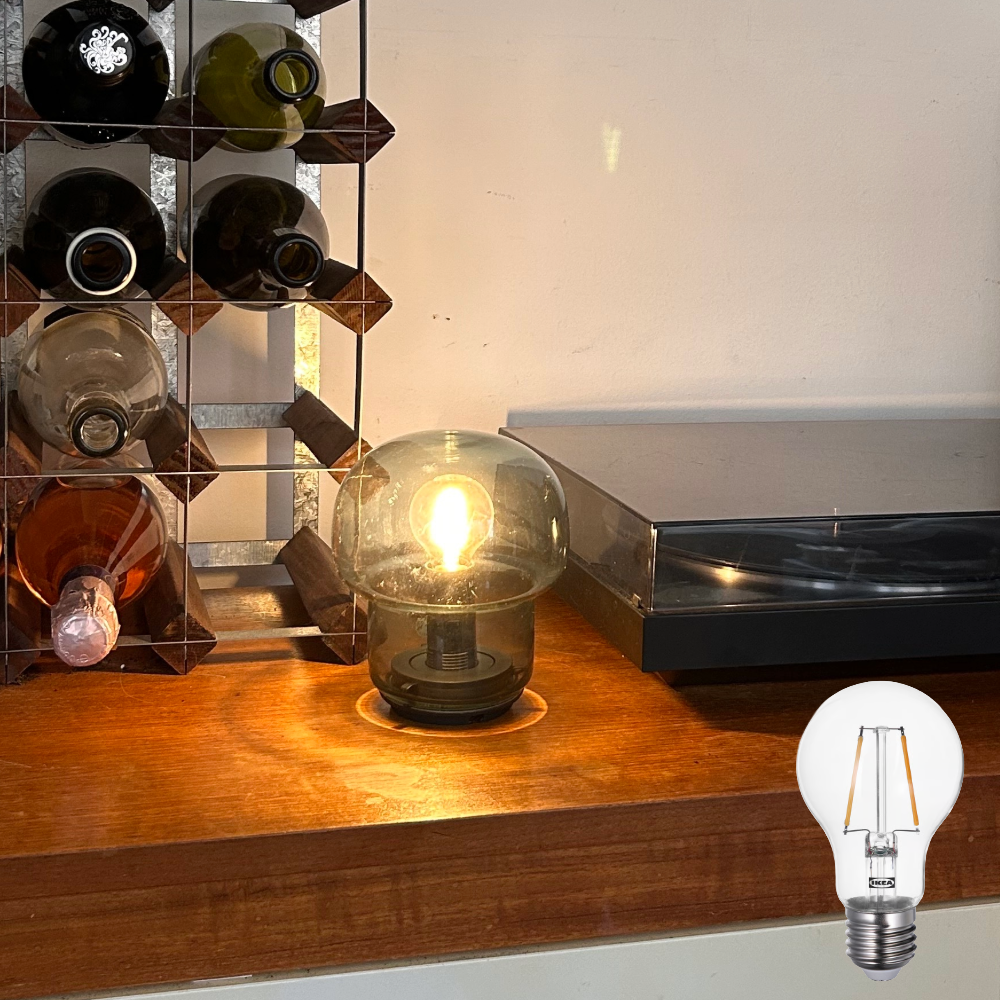LUNNOM LED bulb, one of the best LED bulbs, on Megan's cabinet next to a record player