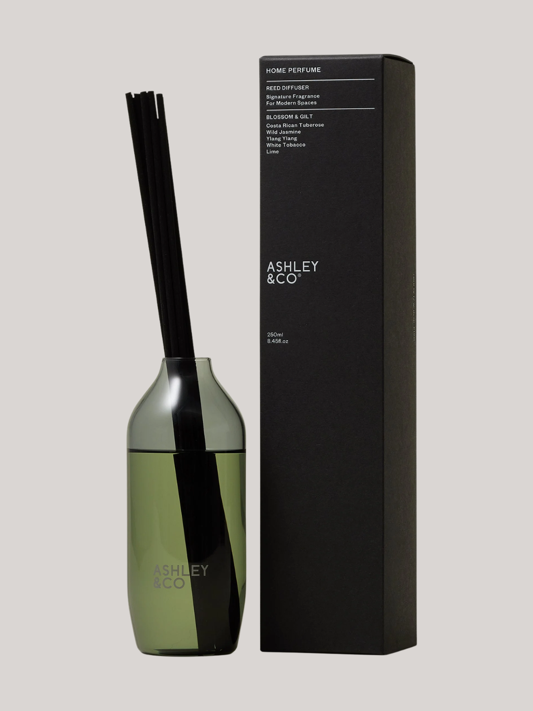 A glass reed diffuser with black reeds from Ashley &amp;amp; Co